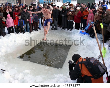 VILNIUS, LITHUANIA – FEBRUARY 7: A fan of winter swimming takes a jump into some icy water on February 7, 2010 in Vilnius, Lithuania.