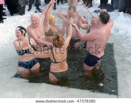 VILNIUS, LITHUANIA – FEBRUARY 7: Fans of winter swimming take a bath in some ice water on February 7, 2010 in Vilnius, Lithuania.
