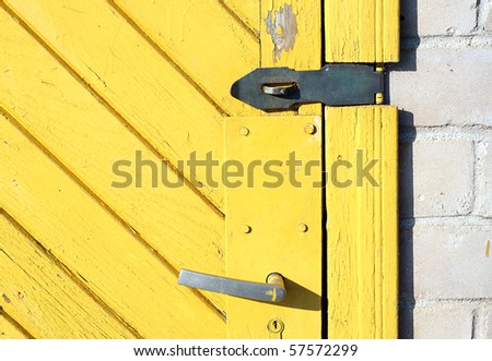 Yellow old  dirty door close-up.