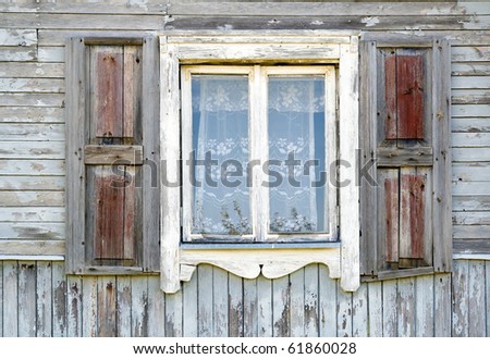 Old dirty white window in the old wooden house texture. The old age concept.