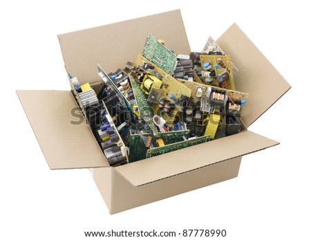 Cardboard box filled with the defective printed circuit boards, prepared for recycling. Mass production. Isolated with patch