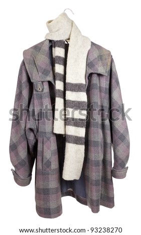 Women\'s checkered tweed old coat, wool angora scarf  hanging on a hanger. Mass production. Isolated with patch
