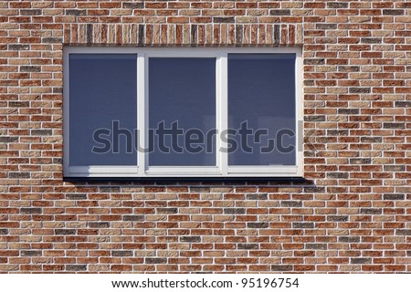 White plastic window and red  brick wall texture