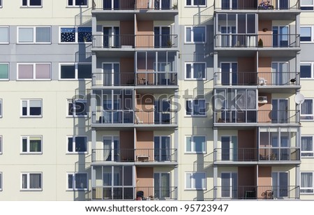 Windows and balconies of a multiroom apartment house of mass building