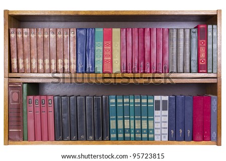 Old retro books with color covers on a wooden shelf  front view. Mass production. Isolated with patch