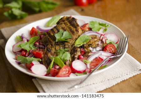 Sizzled masala lamb with chopped salad