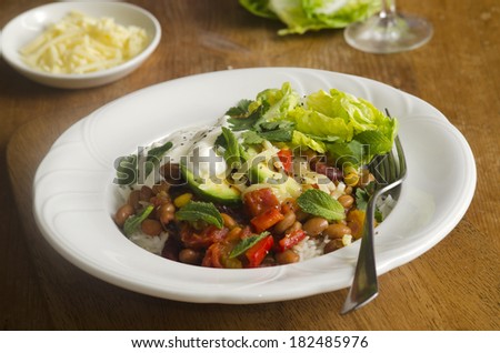 Mexican chili beans with lettuce and avocado