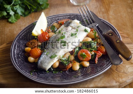 Sea bass with chorizo, tomatoes and butter beans