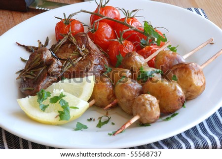 Rosemary lamb steak with potatoes on skewers