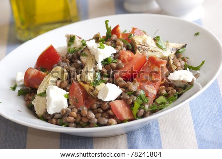 Lentil salad with chorizo, tomatoes, artichokes and feta