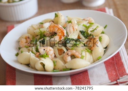 Fennel and prawn conchiglie with herbs in a bowl