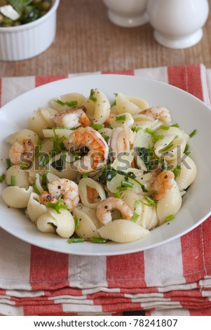 Fennel and prawn conchiglie with herbs in a bowl