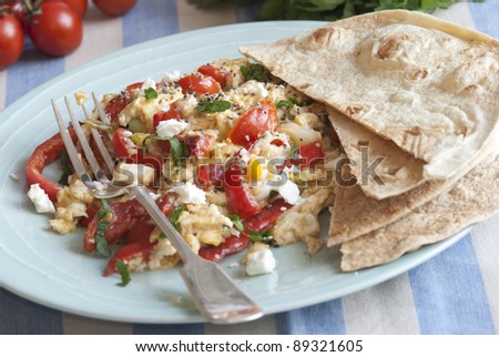 Turkish scrambled eggs, tomatoes and feta with wholemeal wraps