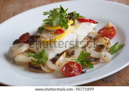Baked cod with potatoes and cherry tomatoes