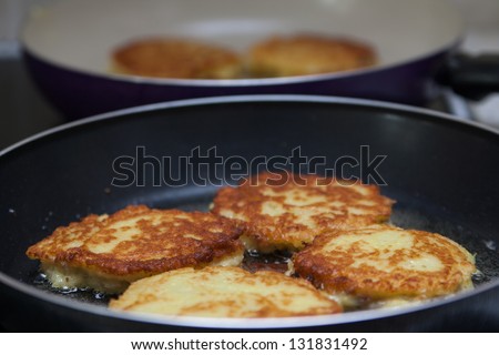 Belarusian potato pancakes with meat fried in a pan