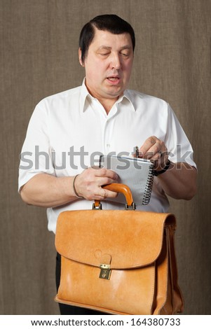 Active man with leather bag.