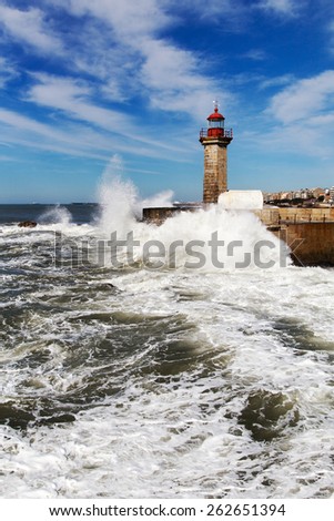 Atlantic waves splashing on Douro river breakwater, Porto , Portugal.