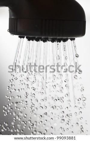 Shower head and falling water drops.