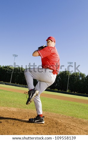 Full length of a young baseball pitcher ready to throw ball