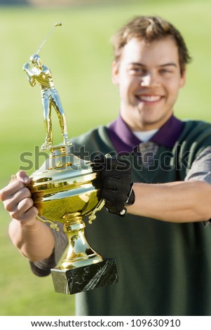 Man Holding Trophy