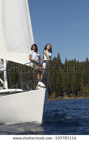 Female friends traveling on sailboat