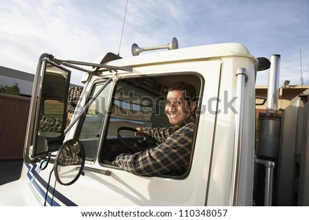 Middle aged man driving truck