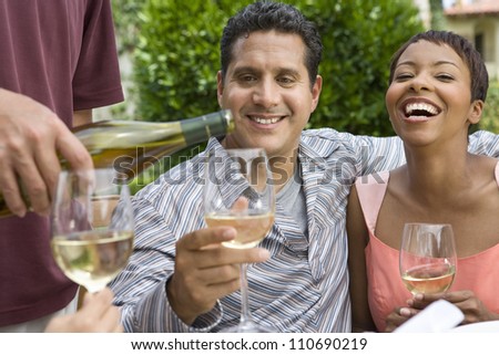 Happy couple tasting wine