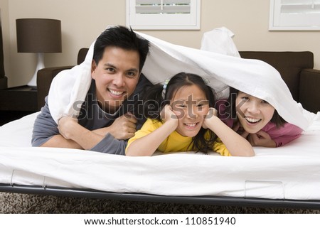 Family Under Bed sheet