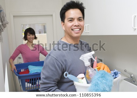 Man Helping Woman At Household Work