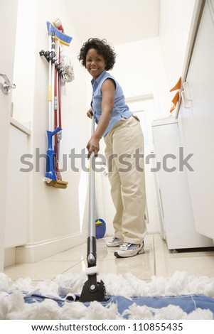 Woman Mopping The Floor
