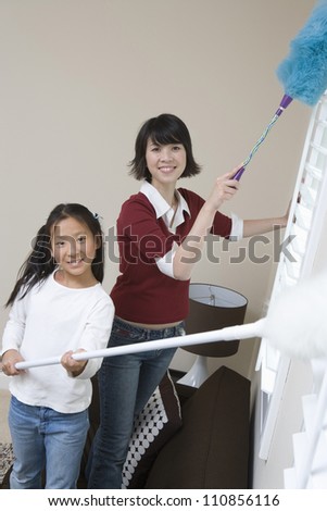 Daughter Helping Mother At Household Work
