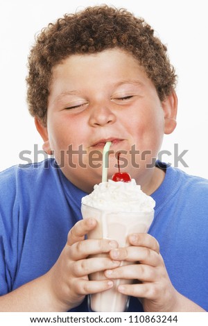 child drinking milkshake