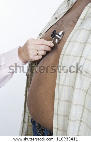 Doctor's Hand Examining Obese Man