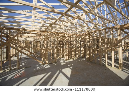 Inside view of roof structure of a wooden house under construction