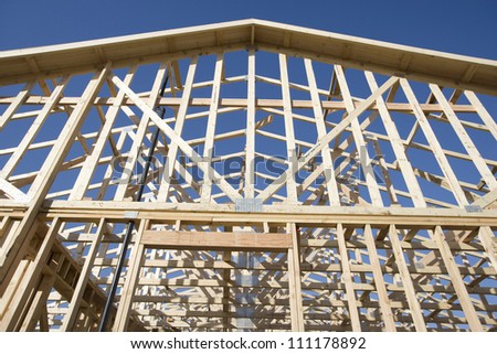Facade of new wooden house under construction