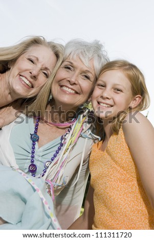 Women and grand daughter smiling together