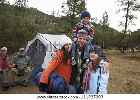 Happy family camping together