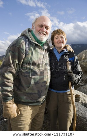 Portrait of a happy senior couple hiking