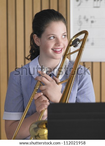 Portrait of a female student with trombone