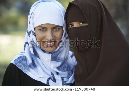 Portrait of two Muslim female friends in traditional clothes
