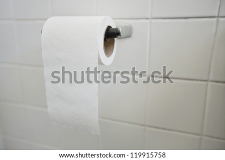 Close-up of tissue paper roll in bathroom