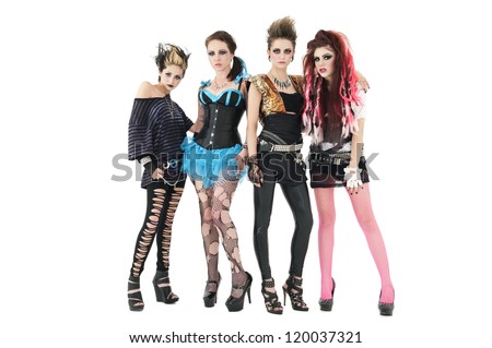 Female rock band posing together over white background