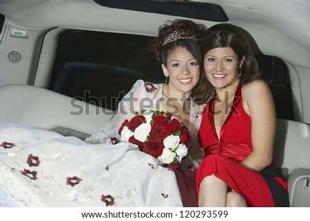 Portrait of a  bride sitting with female friend sitting in car