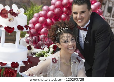 Portrait of a happy newlyweds smiling together on wedding day