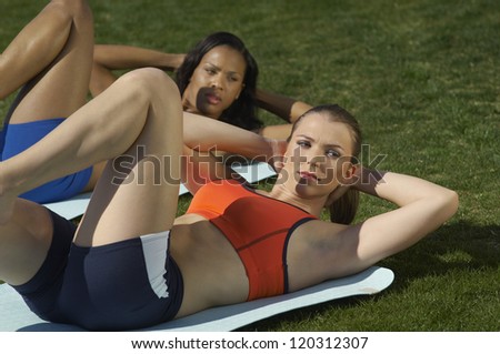 Multi ethnic beautiful women exercising in park