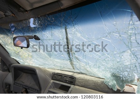 Closeup of car with broken windshield