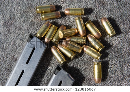 Gun magazines and bullets, closeup
