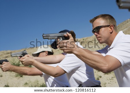 Troops holding guns on training