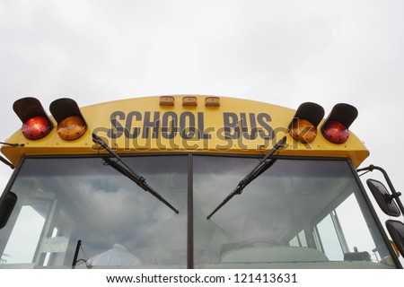 Low angle view of a school bus against sky