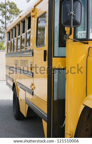 Yellow school bus in parking lot